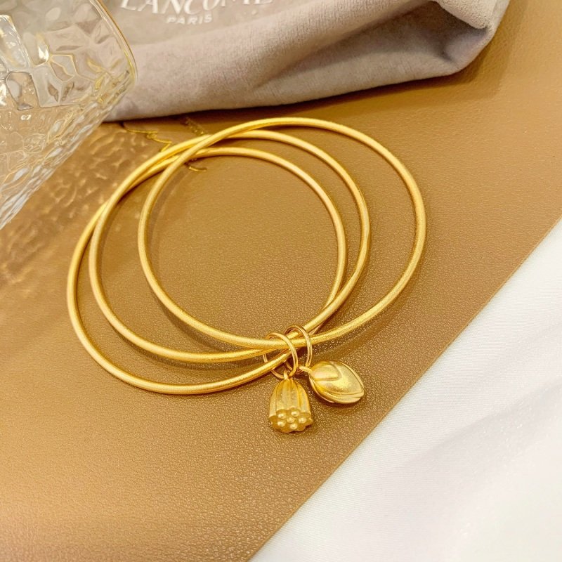 Gold-Toned Bangle Bracelet with Lotus Pod Charm – Affordable Boho Style